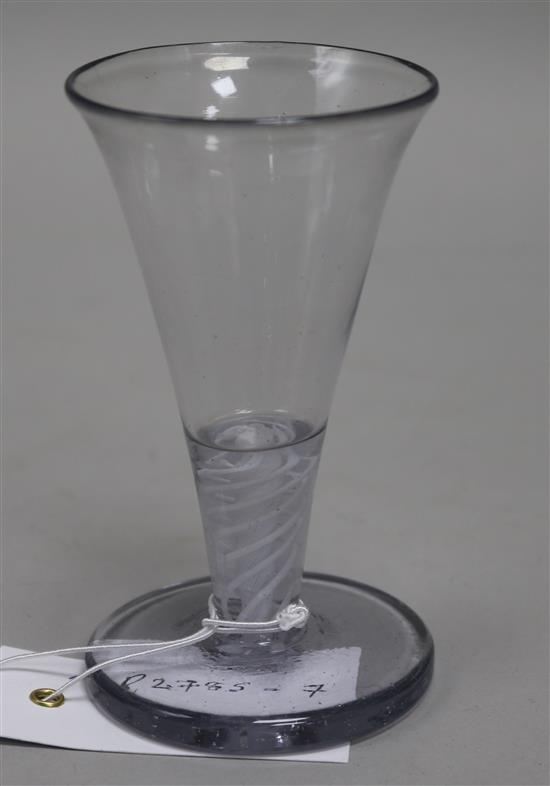 An 18th century firing glass, c.1760, with flared rim bowl and gauze column, encircled by twist opaque stem, 4.5in.